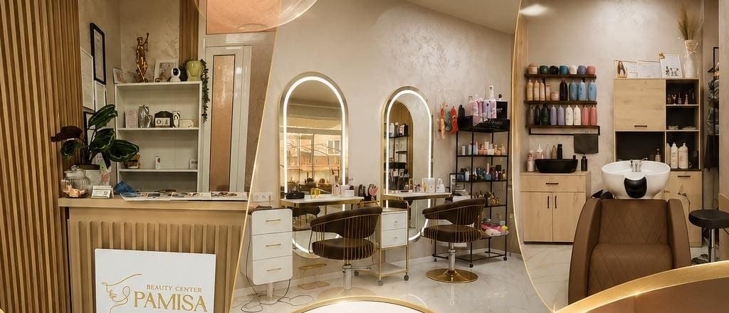 Интериорът на PAMISA Beauty Center с огледала, фризьорски столове и топли златисти акценти